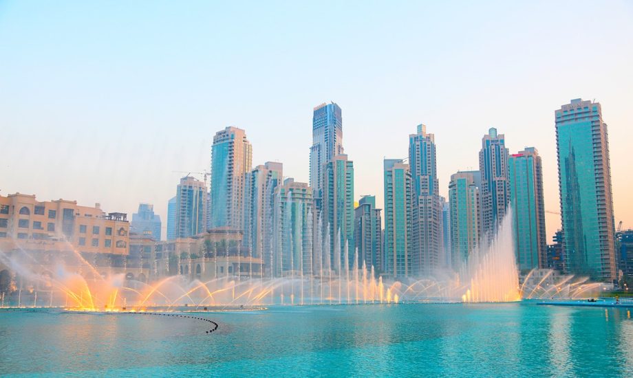 photo-of-water-fountain-across-high-rise-buildings-3145426